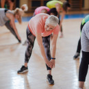Group of people stretching in an exercise class