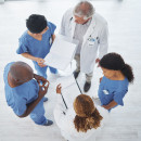 Group of medical professional talking in a circle