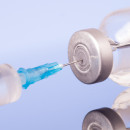 Medical syringe with the needle in the vial