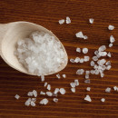 Sea salt in wooden scoop