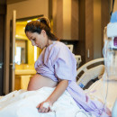 Pregnant person in hospital ward