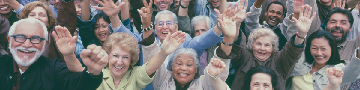 Group of people with arms raised