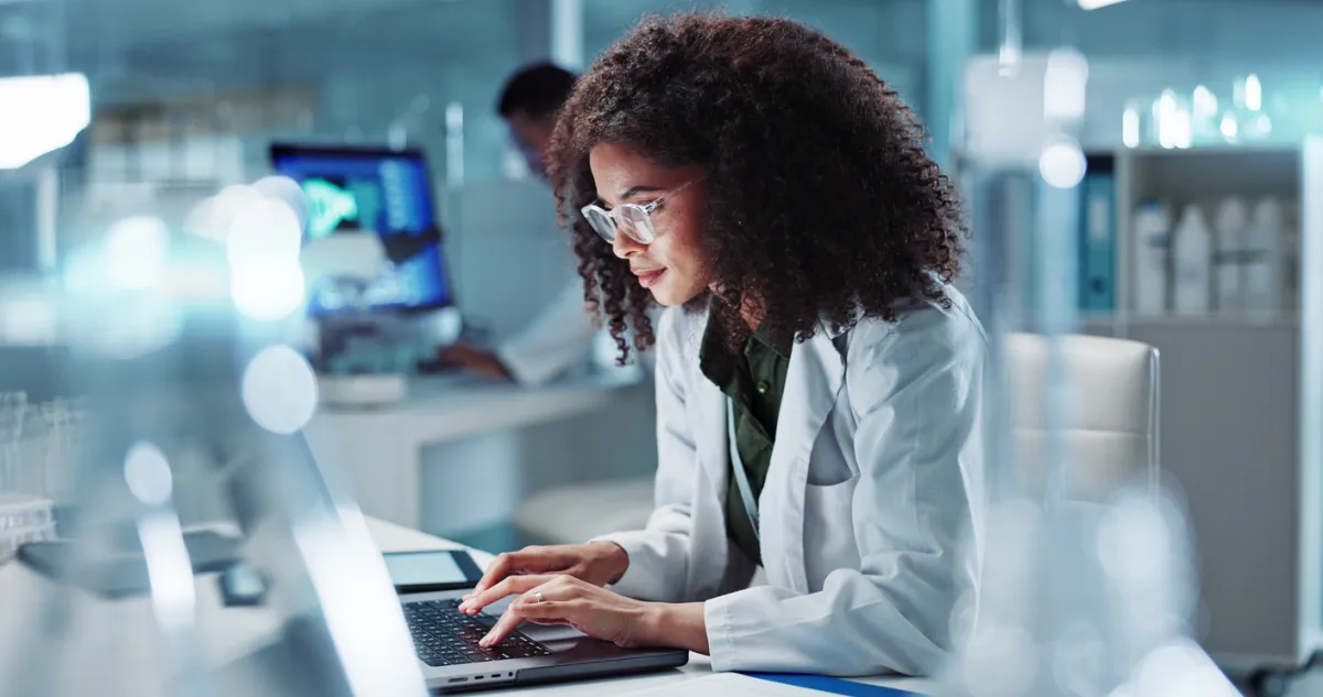 woman working on a laptop in a lab