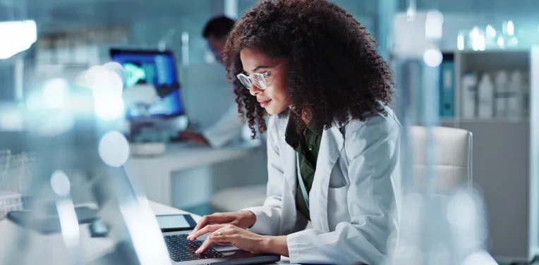 woman working on a laptop in a lab