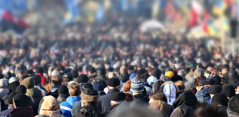 Crowd of anonymous people on street in city center