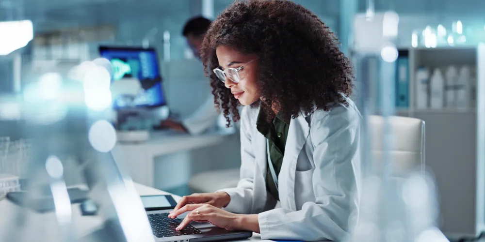 woman working on a laptop in a lab