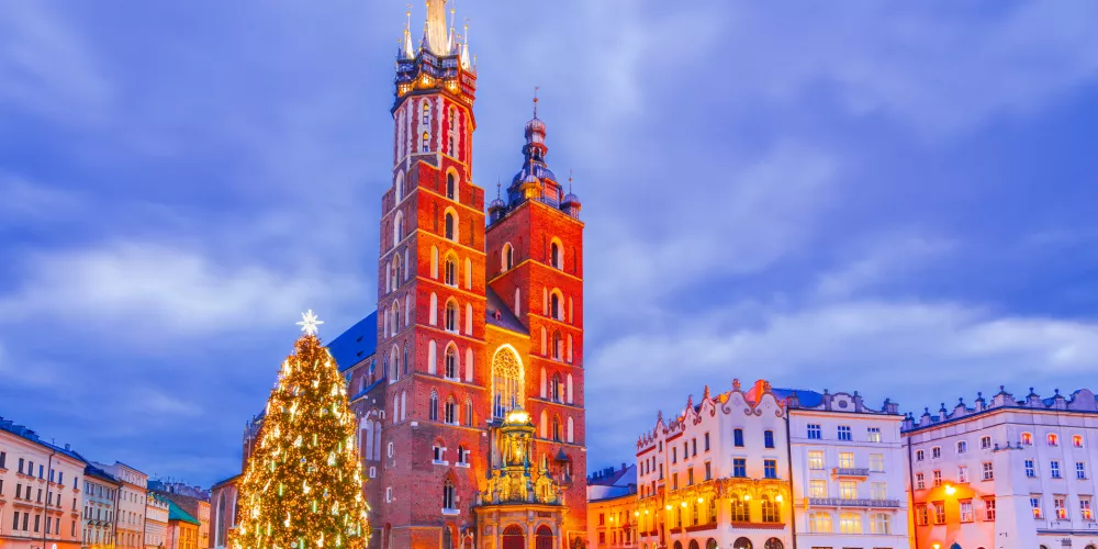 Krakow, Poland. Twinkling lights and Christmas Tree, a magical winter atmosphere in Ryenek Square