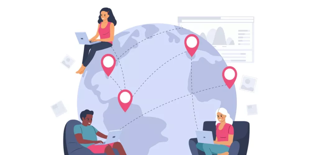 People around a globe working on laptops